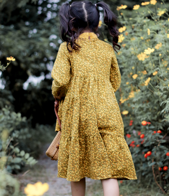 Váy hoa vàng cổ nơ lệch