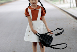 Set áo cam nâu + chân váy yếm trắng